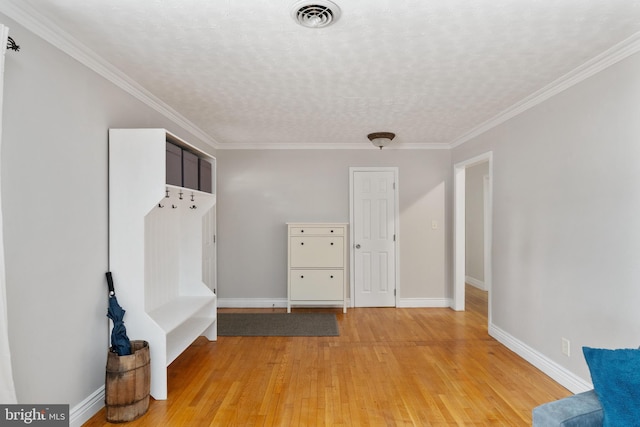 5379 Payne Dr, King George, VA 22485 - mudroom featuring light wood-style flooring, a textured ceiling, and ornamental molding