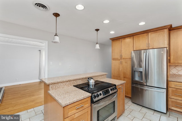 5379 Payne Dr, King George, VA 22485 - kitchen featuring stainless steel appliances, recessed lighting, hanging light fixtures, a center island, and light stone counters