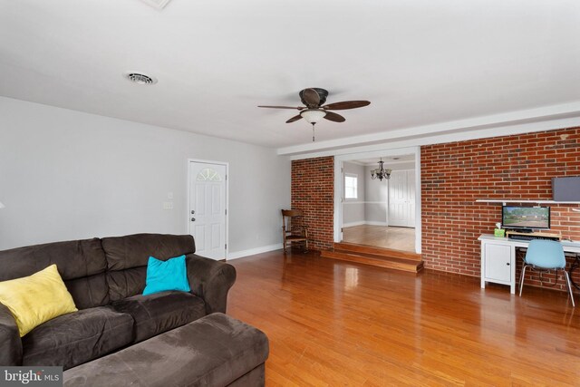 5379 Payne Dr, King George, VA 22485 - living area featuring ceiling fan, light wood-style floors, and a chandelier