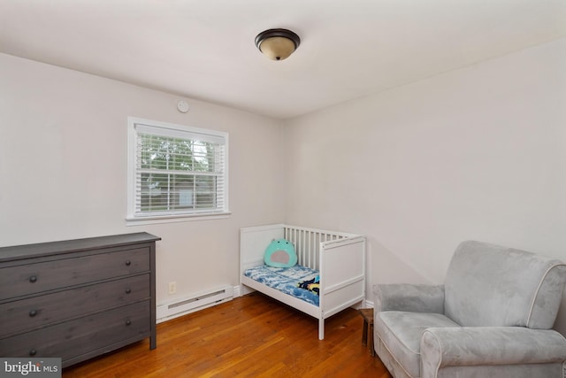 5379 Payne Dr, King George, VA 22485 - bedroom featuring a baseboard radiator and wood finished floors