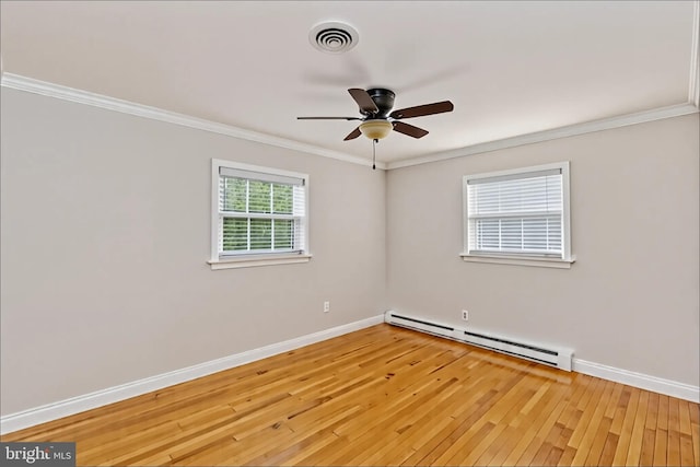 5379 Payne Dr, King George, VA 22485 - spare room featuring a baseboard radiator, light wood-style floors, ceiling fan, and crown molding