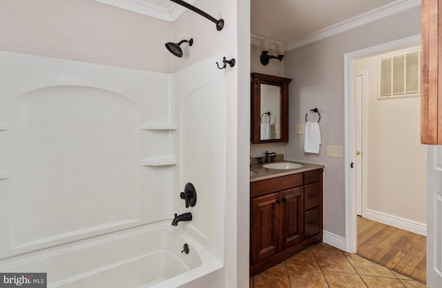 5379 Payne Dr, King George, VA 22485 - bathroom featuring shower / bathtub combination, vanity, ornamental molding, and tile patterned flooring