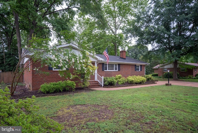 5379 Payne Dr, King George, VA 22485 - ranch-style house with brick siding and a chimney