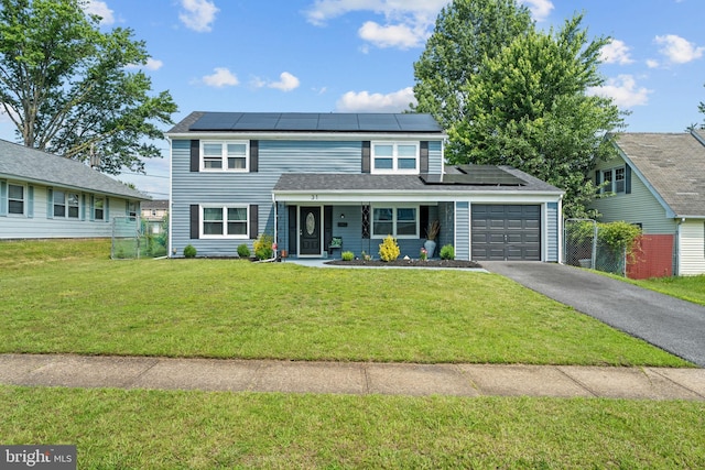 31 Mercator Ln, Willingboro, NJ 08046 - traditional-style house with an attached garage, solar panels, and driveway