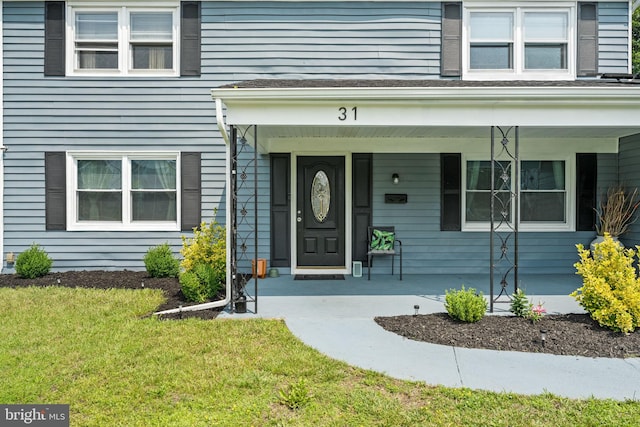31 Mercator Ln, Willingboro, NJ 08046 - view of exterior entry featuring covered porch and a yard