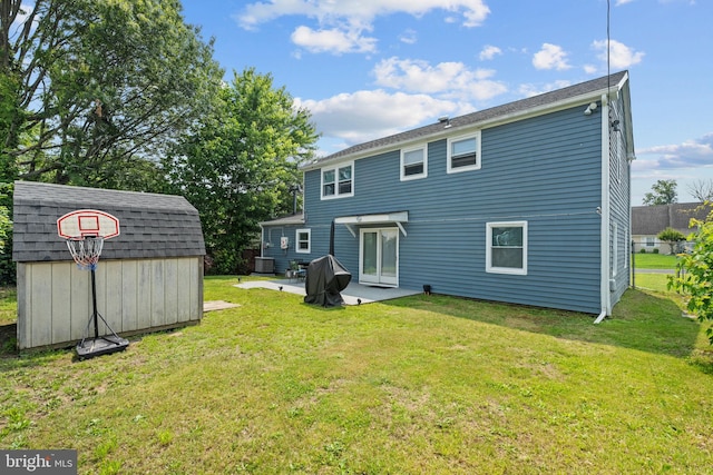 31 Mercator Ln, Willingboro, NJ 08046 - back of house with a storage unit, a patio area, and a yard