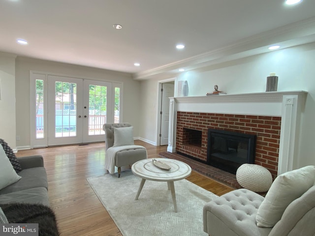 3103 Woodhaven Dr, Cinnaminson, NJ 08077 - living area with french doors, a brick fireplace, wood finished floors, and recessed lighting