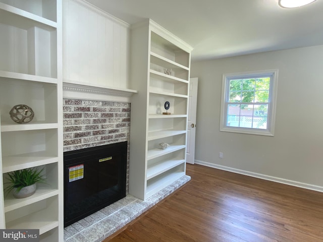 3103 Woodhaven Dr, Cinnaminson, NJ 08077 - unfurnished living room with wood finished floors and a brick fireplace