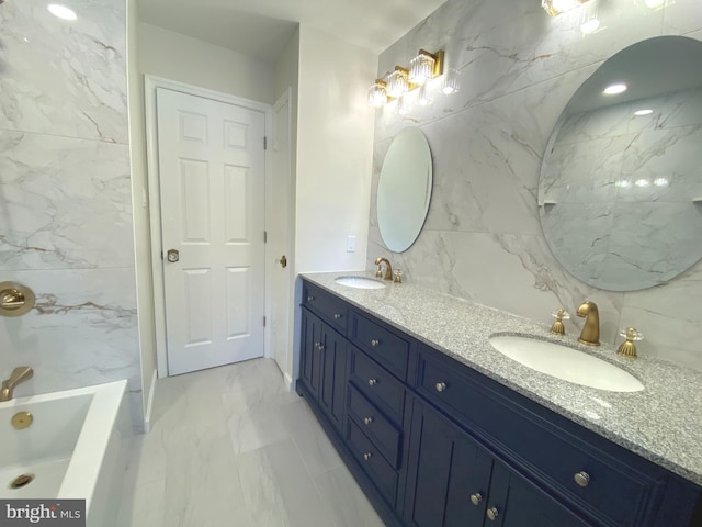 3103 Woodhaven Dr, Cinnaminson, NJ 08077 - full bath featuring double vanity, a tub to relax in, marble finish flooring, and tile walls