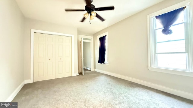 421 N Hanover St, Carlisle, PA 17013 - unfurnished bedroom featuring carpet flooring, a closet, a baseboard heating unit, and a ceiling fan