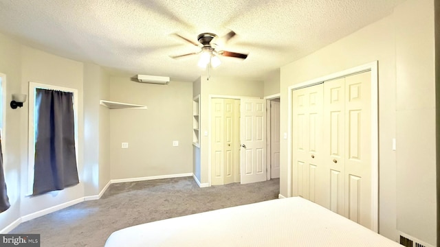 421 N Hanover St, Carlisle, PA 17013 - carpeted bedroom with two closets, a textured ceiling, and ceiling fan