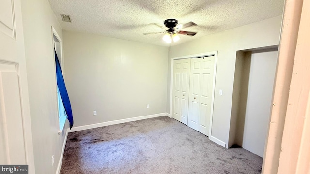 421 N Hanover St, Carlisle, PA 17013 - unfurnished bedroom with carpet flooring, a textured ceiling, a closet, and ceiling fan