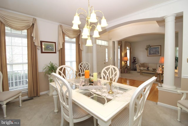 802 Chesapeake Ct, Newark, DE 19702 - dining space with ornate columns, arched walkways, healthy amount of natural light, and ornamental molding