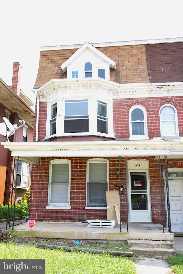 633 N George St, York, PA 17404 - view of front of property with brick siding and covered porch