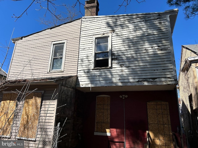 210 Highland Ave, Trenton, NJ 08618 - view of side of property with a chimney