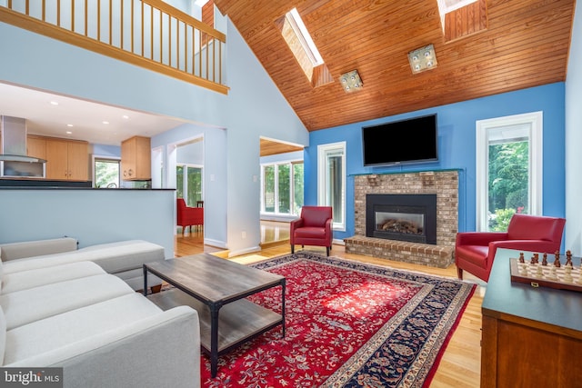 11 Forest Rdg, Newark, DE 19711 - living area with plenty of natural light, light wood-style floors, a fireplace, a skylight, and wood ceiling