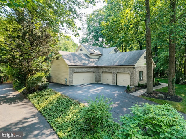 11 Forest Rdg, Newark, DE 19711 - view of front of home with asphalt driveway, a garage, and brick siding