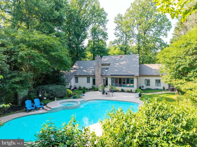 11 Forest Rdg, Newark, DE 19711 - view of swimming pool with a patio, a pool with connected hot tub, and view of scattered trees