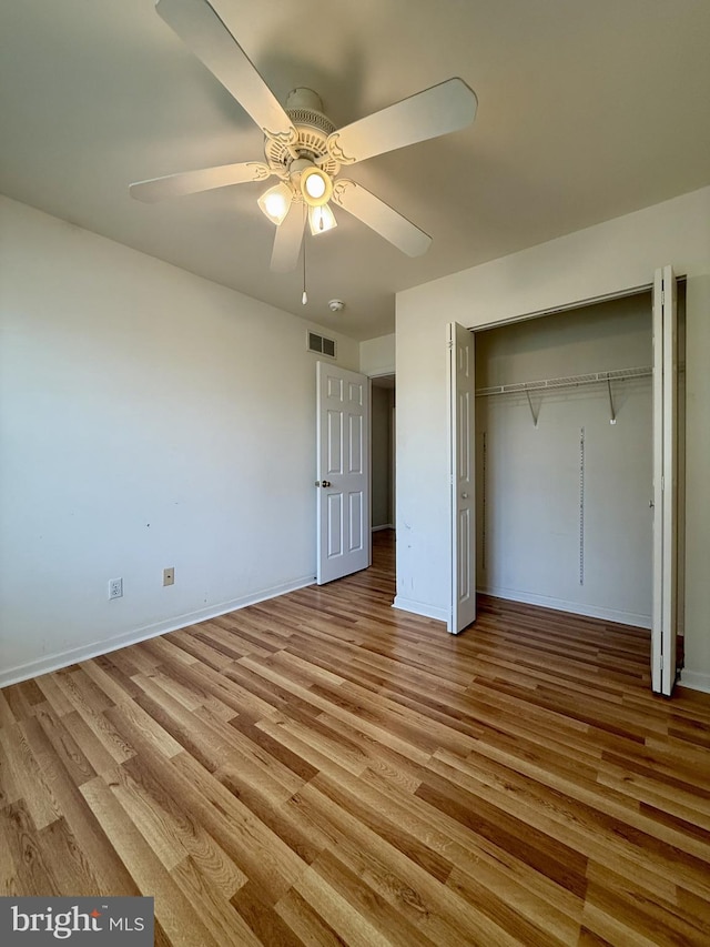 518 Leo Ct, Smyrna, DE 19977 - unfurnished bedroom with light wood-style flooring, a closet, and ceiling fan