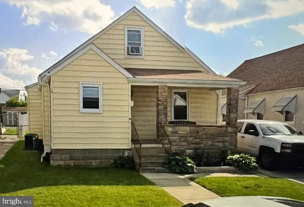 2721 Glendale Rd, Baltimore, MD 21234 - view of front facade featuring a front lawn, entry steps, and stone siding