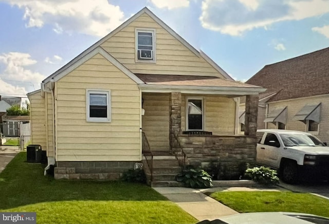2721 Glendale Rd, Baltimore, MD 21234 - view of front facade featuring a front lawn, entry steps, and stone siding