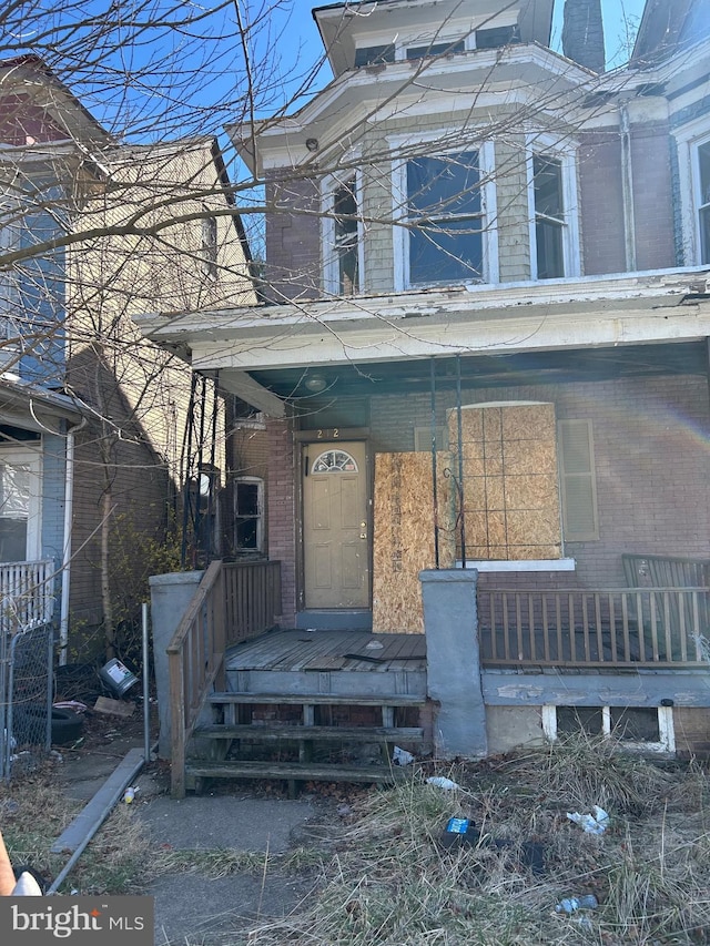 212 Highland Ave, Trenton, NJ 08618 - property entrance featuring brick siding and covered porch