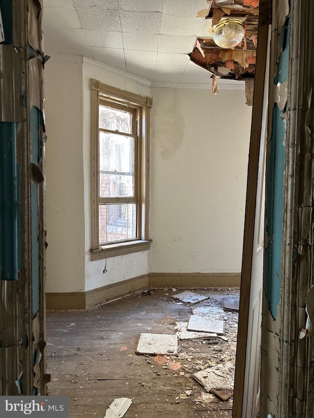 212 Highland Ave, Trenton, NJ 08618 - spare room featuring baseboards and crown molding