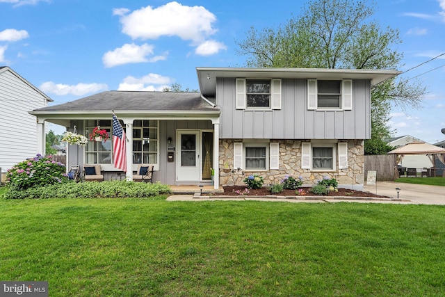 202 E Franklin Ave, Edgewater Park, NJ 08010 - split level home featuring covered porch, stone siding, board and batten siding, and a front lawn