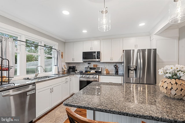 202 E Franklin Ave, Edgewater Park, NJ 08010 - kitchen with appliances with stainless steel finishes, white cabinets, backsplash, crown molding, and dark stone counters