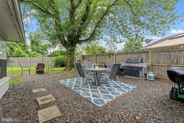 202 E Franklin Ave, Edgewater Park, NJ 08010 - fenced backyard featuring area for grilling, outdoor dining area, and a patio