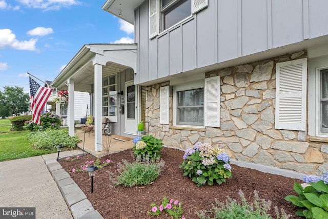 202 E Franklin Ave, Edgewater Park, NJ 08010 - doorway to property with stone siding and board and batten siding