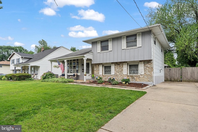202 E Franklin Ave, Edgewater Park, NJ 08010 - tri-level home with stone siding, board and batten siding, covered porch, and concrete driveway