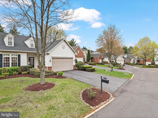 2135 Vittoria Ct Unit 33, Bowie, MD 20721 - view of front of home featuring a residential view, asphalt driveway, a garage, a front lawn, and brick siding