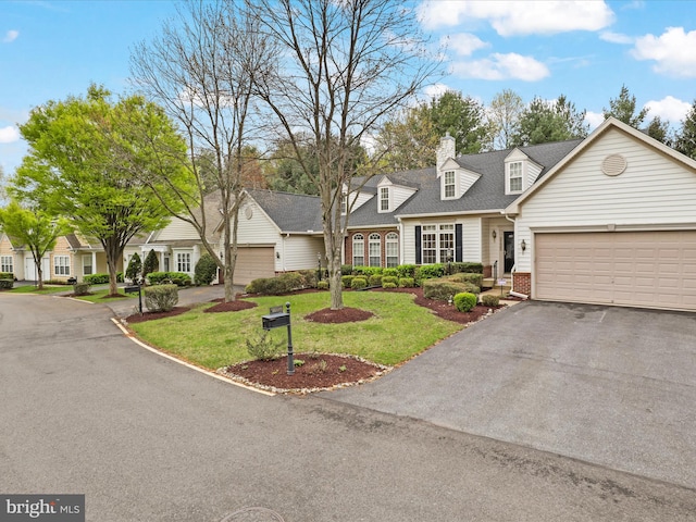 2135 Vittoria Ct Unit 33, Bowie, MD 20721 - cape cod house with brick siding, driveway, a front yard, and an attached garage