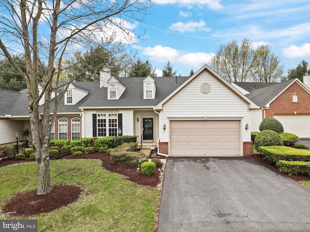 2135 Vittoria Ct Unit 33, Bowie, MD 20721 - cape cod home featuring asphalt driveway, a garage, brick siding, a shingled roof, and a front lawn