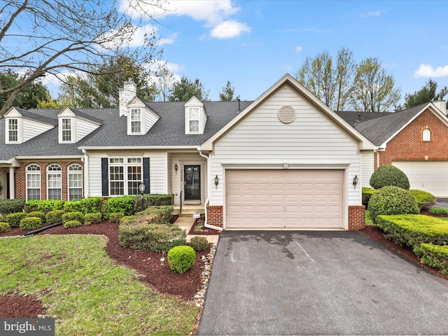 2135 Vittoria Ct Unit 33, Bowie, MD 20721 - cape cod home featuring driveway, brick siding, a shingled roof, and an attached garage