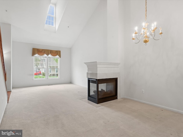 2135 Vittoria Ct Unit 33, Bowie, MD 20721 - unfurnished living room featuring carpet floors, a chandelier, high vaulted ceiling, a high end fireplace, and a skylight