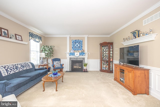 1 Chase Cir, Barto, PA 19504 - living area with a fireplace, crown molding, light carpet, a wainscoted wall, and a decorative wall