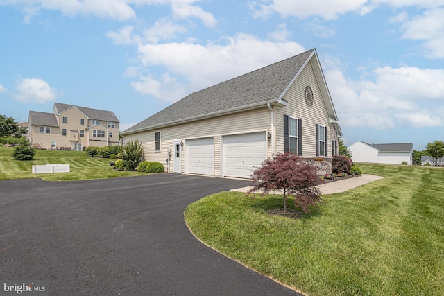 1 Chase Cir, Barto, PA 19504 - view of home's exterior with driveway, roof with shingles, a lawn, and a garage