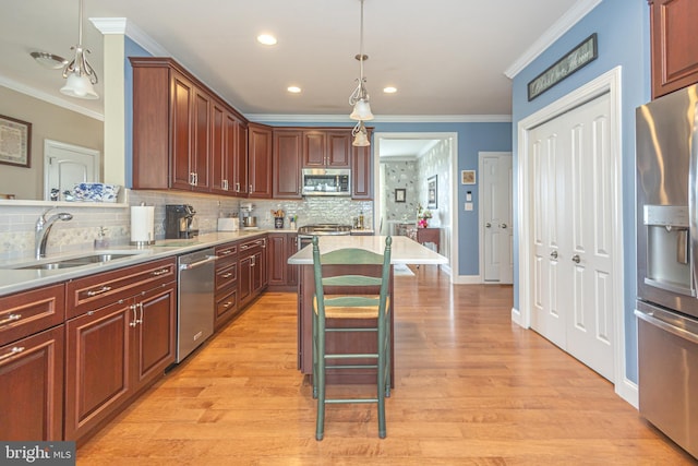 1 Chase Cir, Barto, PA 19504 - kitchen featuring appliances with stainless steel finishes, ornamental molding, backsplash, light countertops, and decorative light fixtures