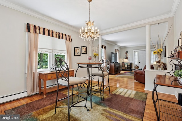 2465 Edgecomb Ave, Glenside, PA 19038 - dining room featuring wood finished floors, crown molding, and a chandelier