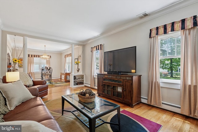2465 Edgecomb Ave, Glenside, PA 19038 - living room featuring a chandelier, a baseboard heating unit, wood finished floors, crown molding, and a baseboard radiator