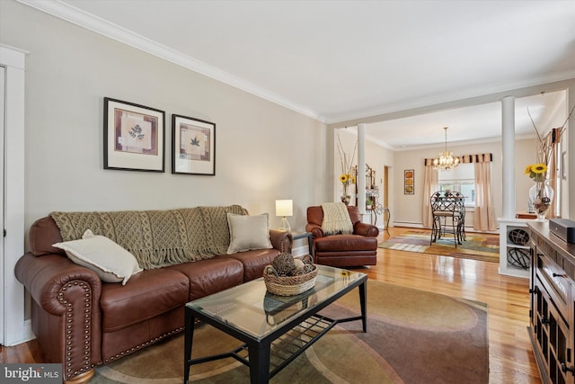 2465 Edgecomb Ave, Glenside, PA 19038 - living room with a chandelier, wood finished floors, and crown molding