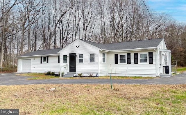 16000 Manning Rd W, Accokeek, MD 20607 - ranch-style home with entry steps, asphalt driveway, a front lawn, and a garage