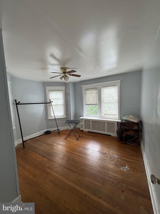 2004 N Jefferson St, Wilmington, DE 19802 - unfurnished room with radiator heating unit, wood finished floors, and ceiling fan