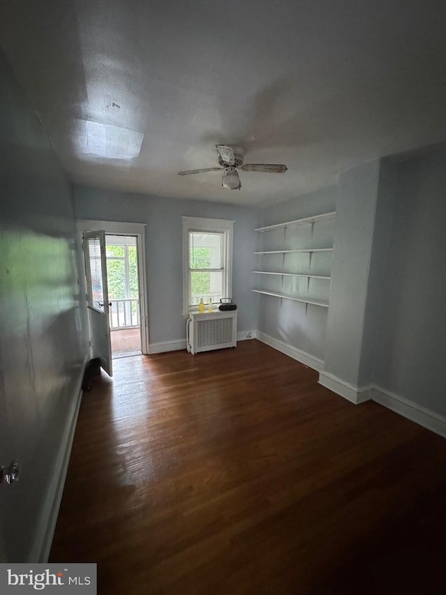 2004 N Jefferson St, Wilmington, DE 19802 - unfurnished living room featuring wood finished floors, a ceiling fan, and radiator heating unit