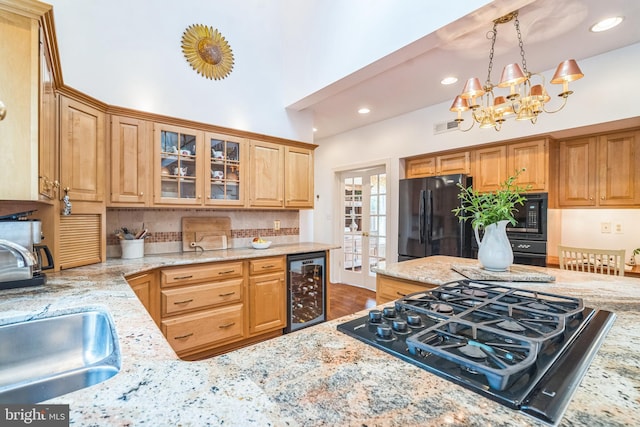 580 Buchanon Rd, Honey Brook, PA 19344 - kitchen featuring black appliances, beverage cooler, light stone counters, decorative backsplash, and recessed lighting