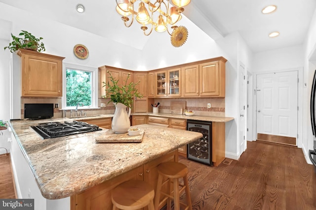 580 Buchanon Rd, Honey Brook, PA 19344 - kitchen featuring beverage cooler, black gas stovetop, dark wood-type flooring, tasteful backsplash, and glass insert cabinets