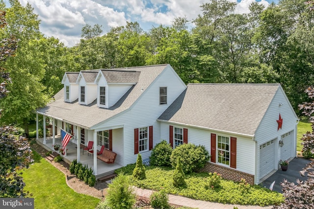 580 Buchanon Rd, Honey Brook, PA 19344 - view of front facade with a garage, a porch, a shingled roof, and asphalt driveway