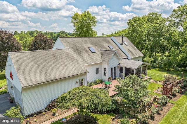 580 Buchanon Rd, Honey Brook, PA 19344 - rear view of house featuring a sunroom, a shingled roof, a wooden deck, and view of scattered trees